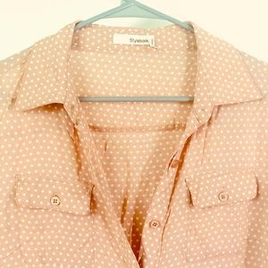 Button-up dress with collar and tie around waist.